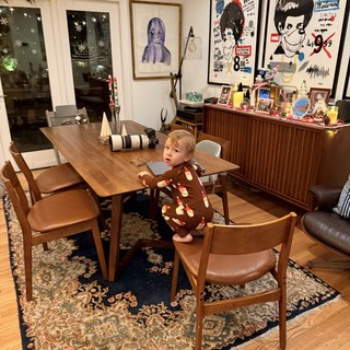 Toddler Standing on Chair in Mid-Century Modern Dining Room