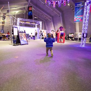 Child Explores Interactive Museum Exhibition Space