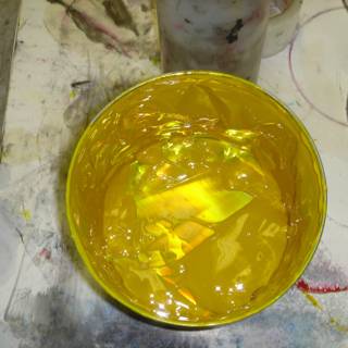 Yellow Paint Bucket on Table