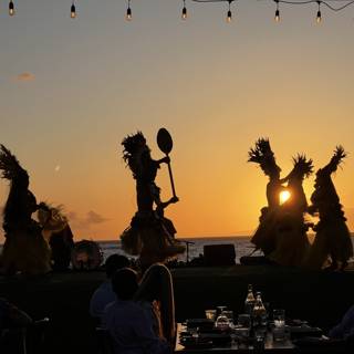Silhouettes of Dancers at Sunset