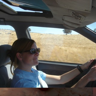 Woman Driving Through Sun-Drenched California Countryside