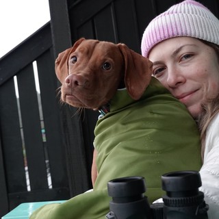 Woman and Dog Share Cozy Outdoor Moment