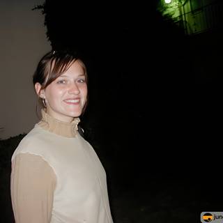 Nighttime Portrait of a Smiling Woman