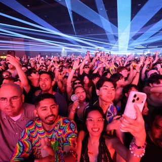 Massive Crowd Electrified Under Laser Light Show