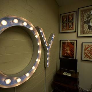 Illuminated 'y' Sign in Artistic Frame