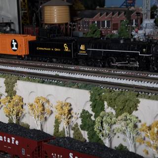 11-wheeled toy train on railway diorama