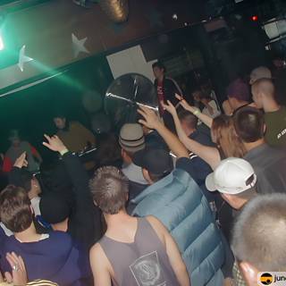 Nightclub Partygoers with Hands Up