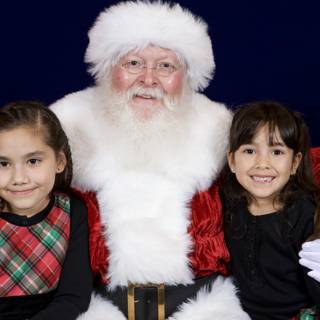 Santa Claus Celebrates Christmas with Two Girls