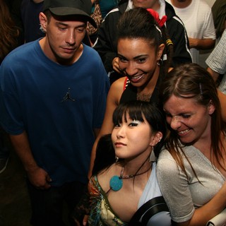 Friends Posing Together at Late Night Party Event