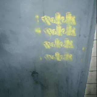 Bold Yellow Graffiti on Building Wall