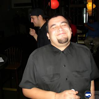 Smiling Man in Black Shirt