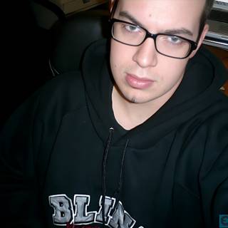Dave B in Black Hoodie and Glasses