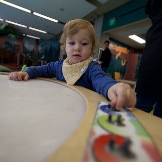 Toddler Engaged in Learning Activity at Children's Museum