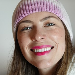 Woman with Pink Beanie Bright Smile Portrait