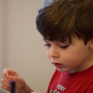 Young Boy in Festive Red Shirt at Christmas Time