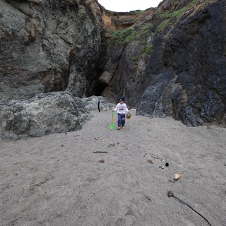 Young Explorer in a Rocky Coastal Canyon