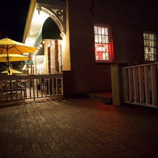 Illuminated Courtyard Dining Area at Night in Santa Fe