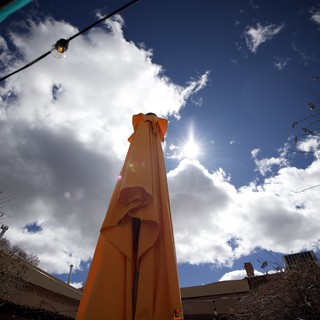 Orange Tower Monument Under Dramatic Desert Sky