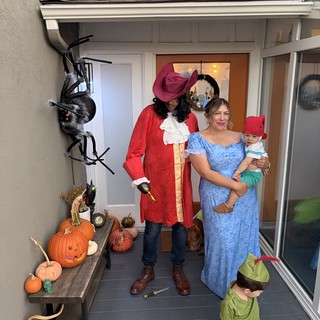 Peter Pan Family Halloween Costume on Decorated Porch