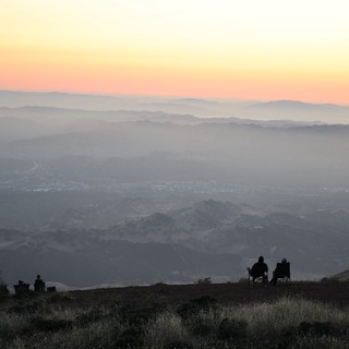 Twilight Silhouettes Overlooking the Valley Below