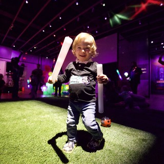 Toddler with Glow Sticks at Baby Rave Event