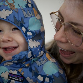 Joyful Winter Moment: Parent and Child Smiling Together