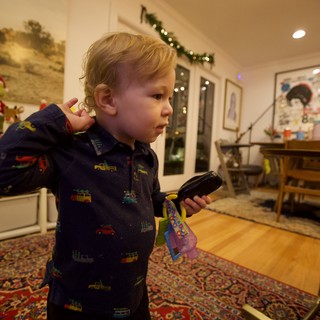 Toddler on Christmas Morning with Remote Control