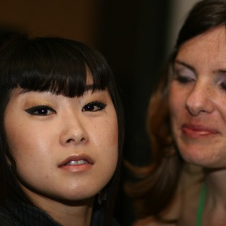 Two Women Share a Quiet Moment at Event