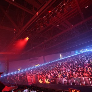 Massive Crowd Ignites Under Laser Light Storm