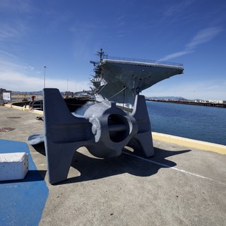 Naval Anchor and Aircraft Carrier at Harbor