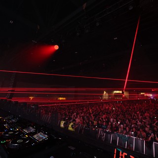 DJ Ignites the Crowd with Blazing Red Lasers