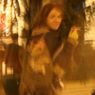 Blurry Snapshot of a Woman and Her Feline Companion