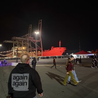 Industrial Port Night Scene with Cargo Ship and Cranes