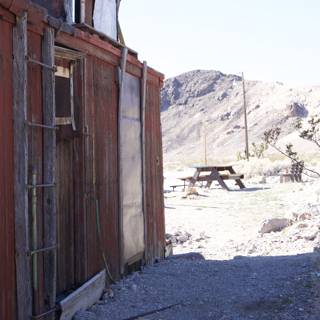 Man and Building amidst Death Valley's Winter Landscape