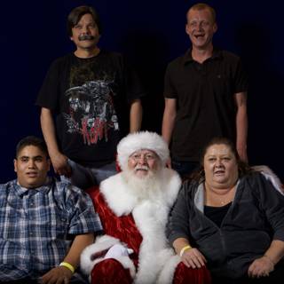 A Group of Festive People with Santa Claus