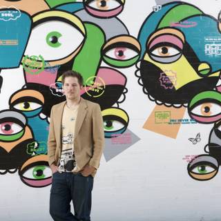 Staring Back: A Man Confronts a Wall of Eyes
