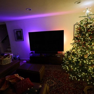 Cozy Christmas Living Room with Illuminated Tree at Night