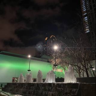 Illuminated Fountain in a Metropolis