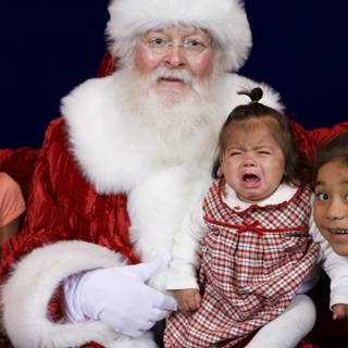 Santa Claus spreading joy with three children