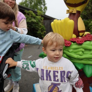 Young Children Explore Hot Air Balloon Festival Sculpture