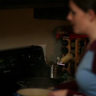 Late Night Cooking in a Dimly Lit Kitchen
