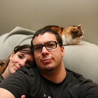 Cozy Couple Selfie with Calico Cat Companion