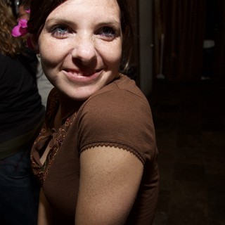Smiling Woman with Pink Flower at Art Walk