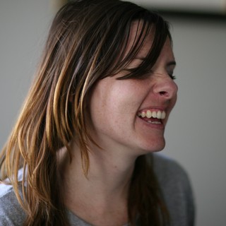 Candid Laughter: Woman with Sun-Kissed Hair