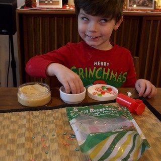 Child Playing with Elf Breakfast Play Dough Kit at Christmas