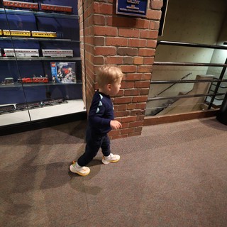 Young Child Exploring Railroad Museum Gallery