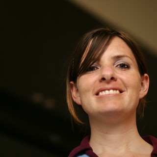Candid Portrait of a Smiling Young Woman Indoors