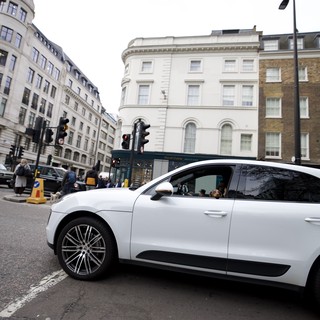 White Luxury Car on London Street Corner