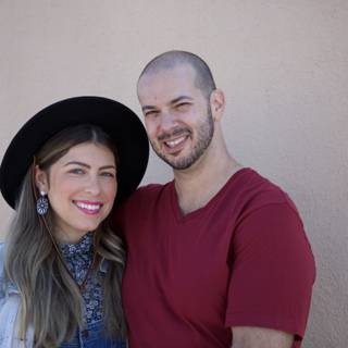 Smiling Couple in Matching Hats