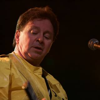 Yellow-shirted guitar man